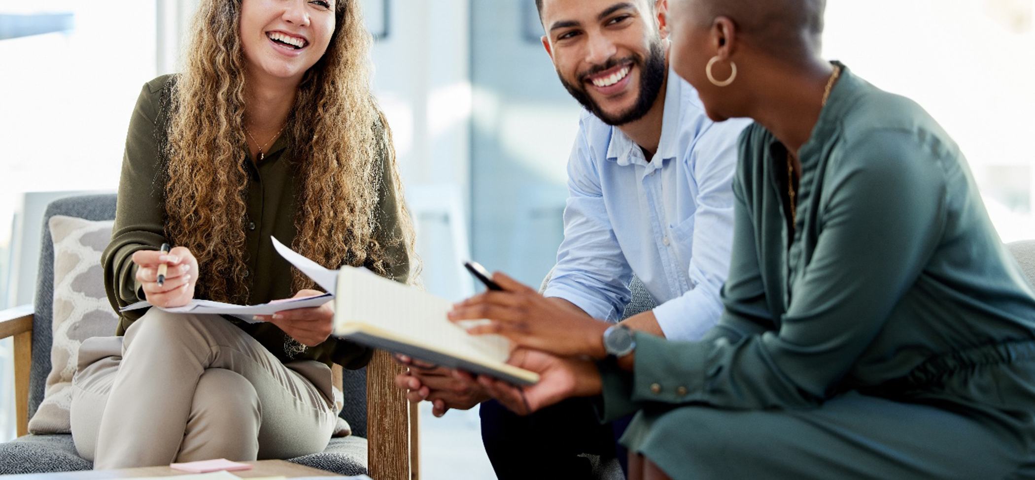 Group of professionals smiling and showing off their veneers in Lincoln Park
