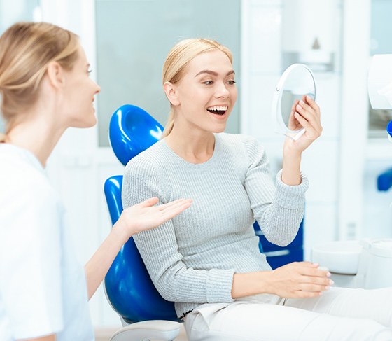 Young woman excited to see her new smile
