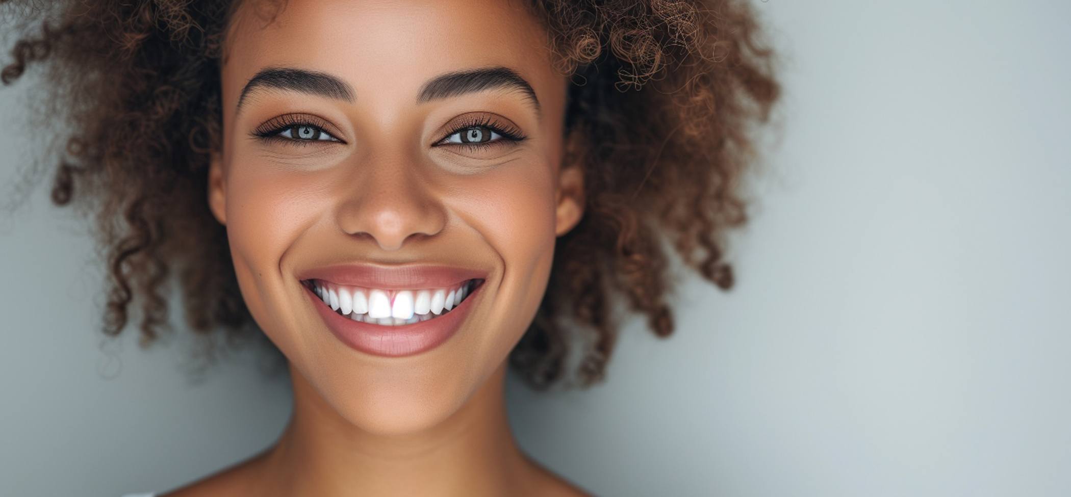 Woman showing off teeth whitening results in Lincoln Park